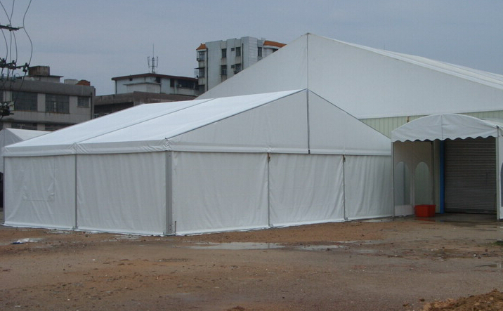 outdoor clear span marquee festival setup with vendor booths