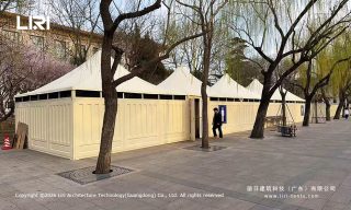 High-peak marquee tents used for mobile public restrooms