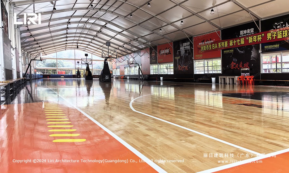 clear span basketball marquee with multiple hoops and bleachers