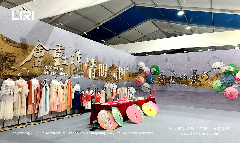 Han clothing and oil-paper umbrella display inside the marquee