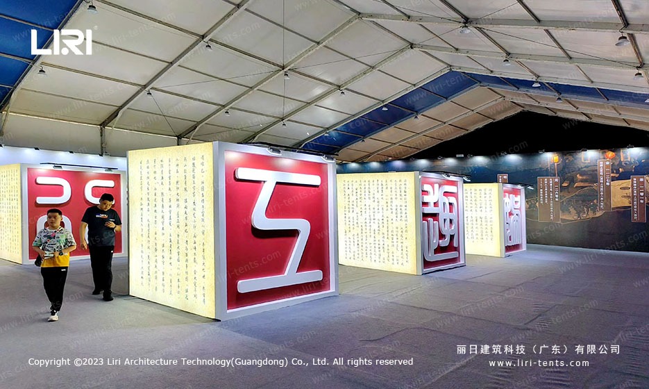 Red Chinese character wall installation inside the marquee