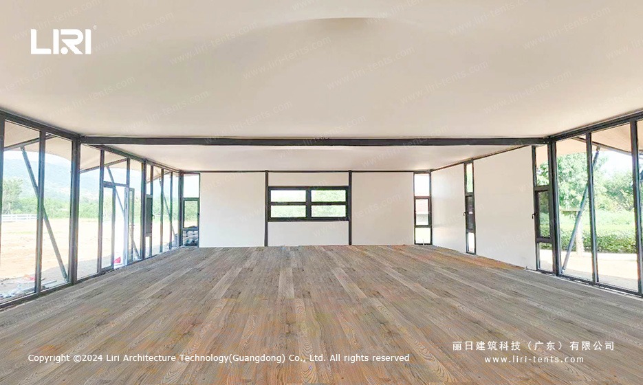 Interior of 10x25m tension membrane marquee tent with wood flooring