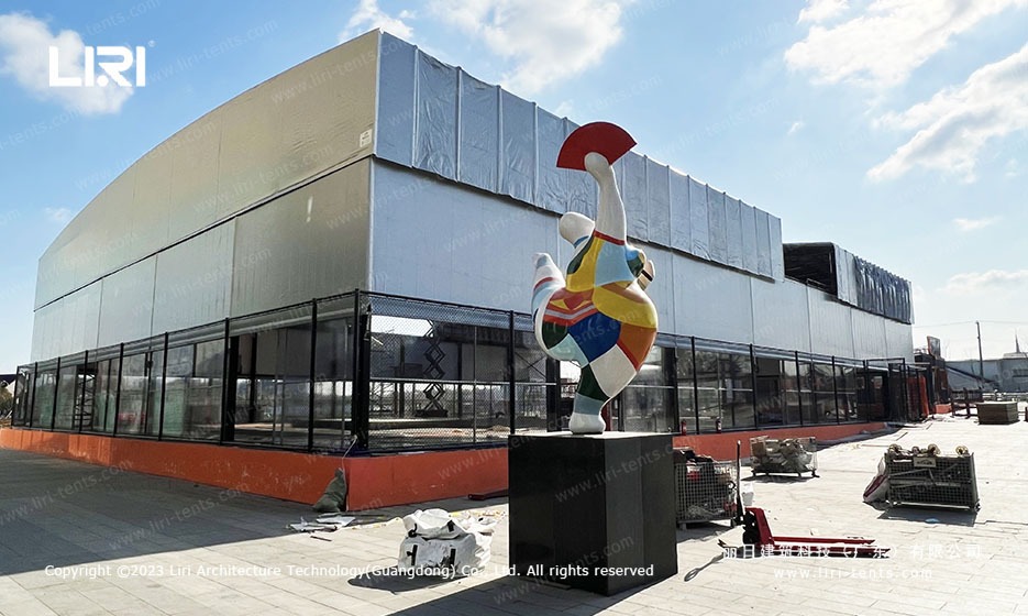 Basketball Tent Exterior with Colorful Statue and Mesh Walls