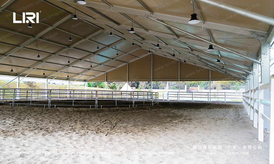 Interior view of the equestrian arena marquee with sand ground and round pen