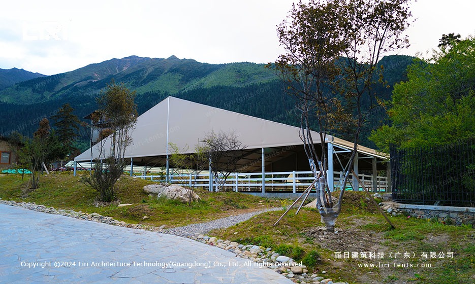 Side view of the equestrian marquee showing the eave height and the side railing