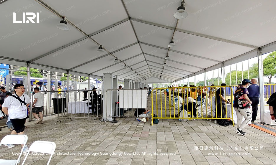 Security checkpoint interior of clear span marquee tent with high ceiling at the 2025 Shanghai E-Prix