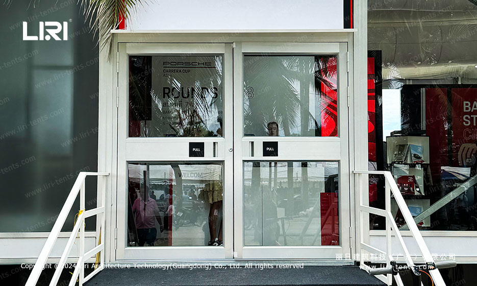 Glass entrance at Porsche motorsport event marquee
