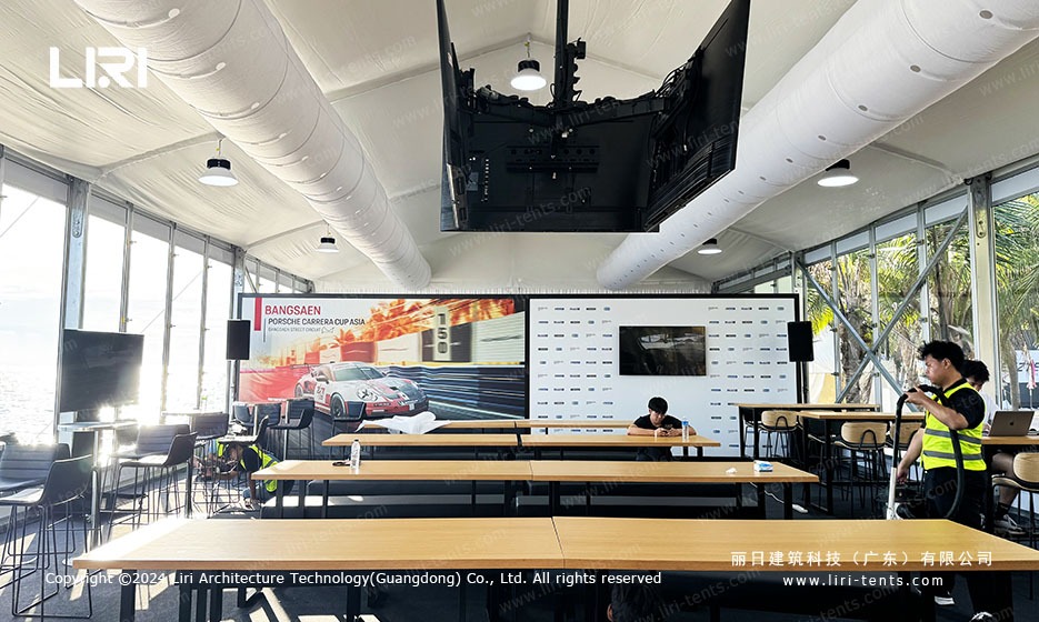 Racing banner wall and media setup in marquee