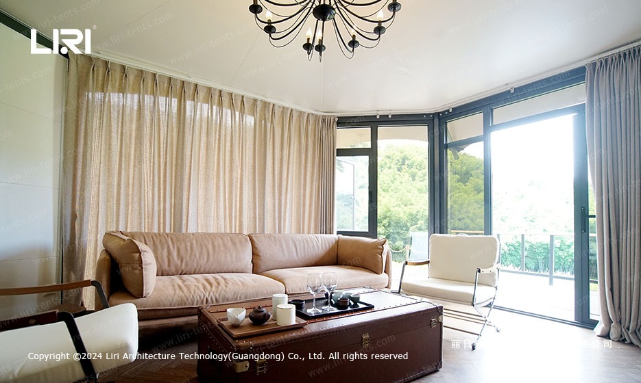Safari lounge interior with sofa and forest views