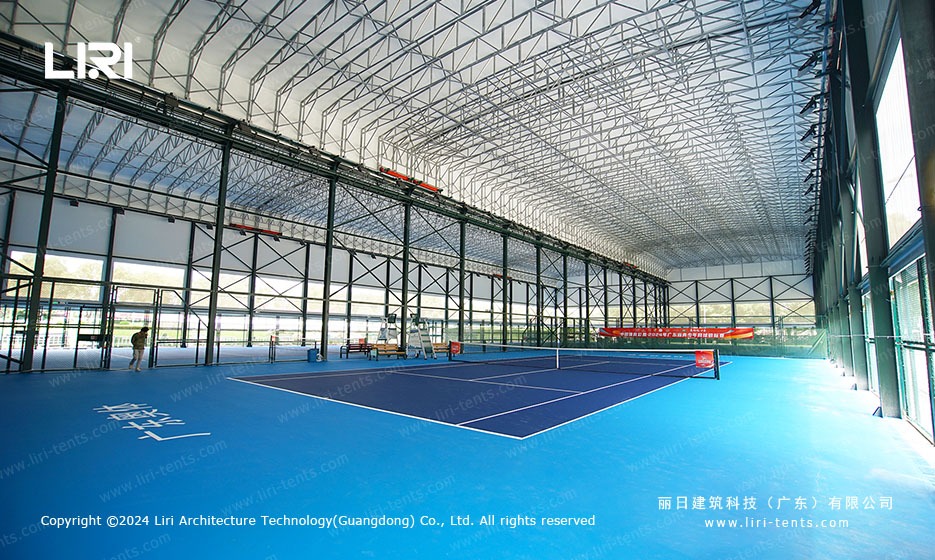 Interior view of TFS curve structure tennis venue with full clear span