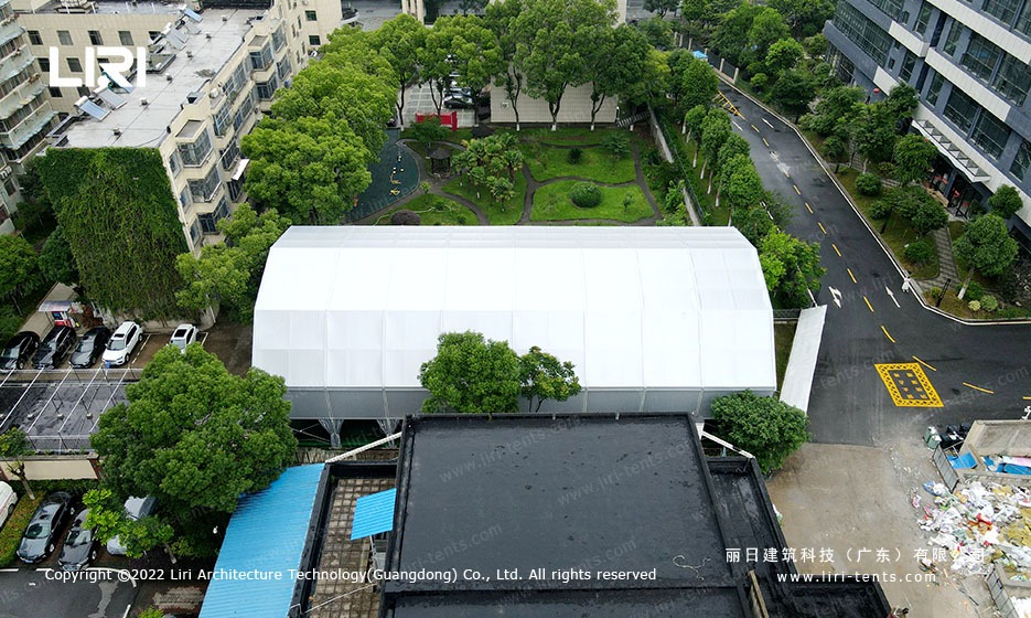 Aerial view of arcum roof profile over single tennis court