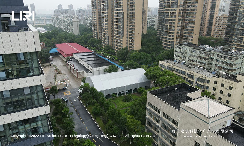 Drone view of polygon tennis marquee from above showing bay grid