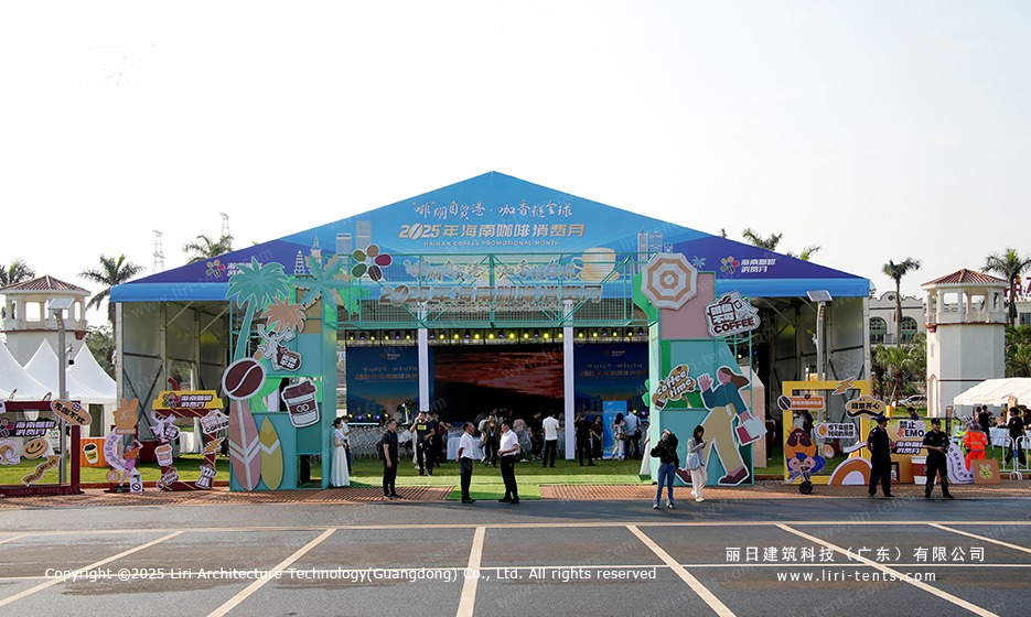Clear span marquee tent entrance decorated for hainan coffee festival trade month with palm tree graphics