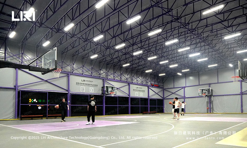 Customers playing pickup basketball inside purple gable marquee under retractable roof