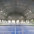 Polygon tennis marquee exterior with arcum roof on a city sports facility