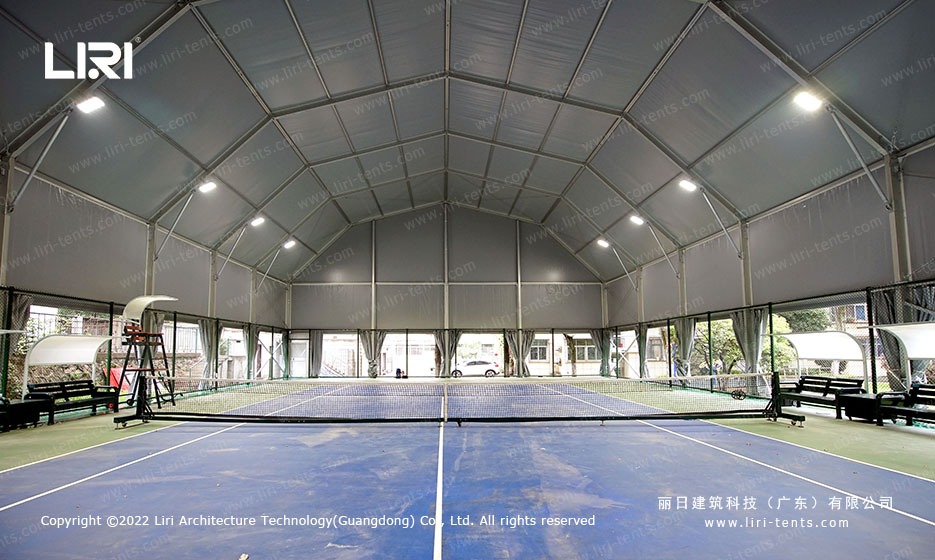 Polygon tennis marquee exterior with arcum roof on a city sports facility