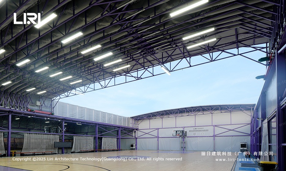 Purple gable marquee retractable roof opened mid day to expose the court to the open sky