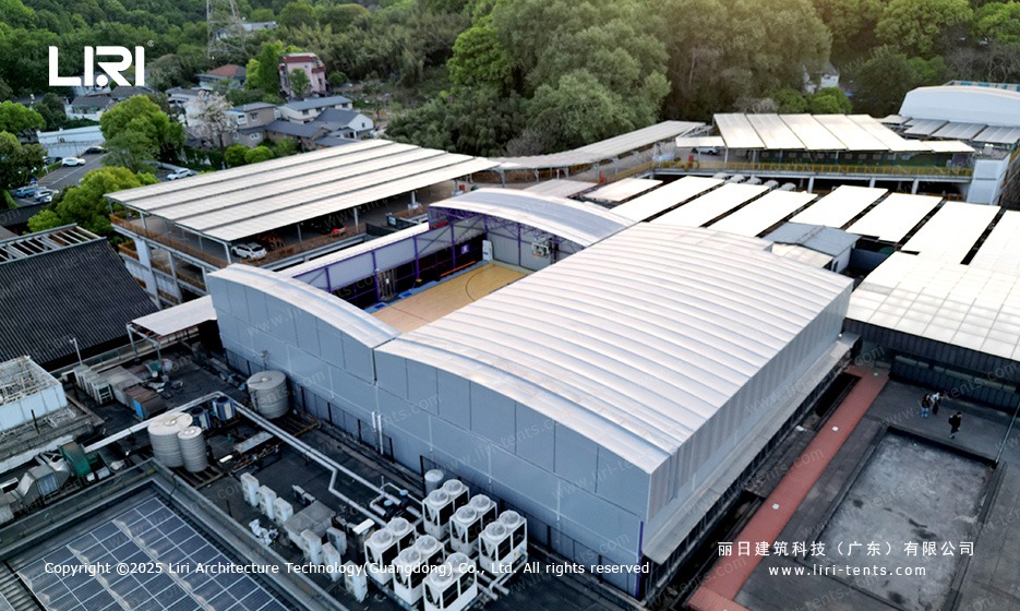 Purple gable twin peak marquee rooftop site set between solar panel arrays on city roof