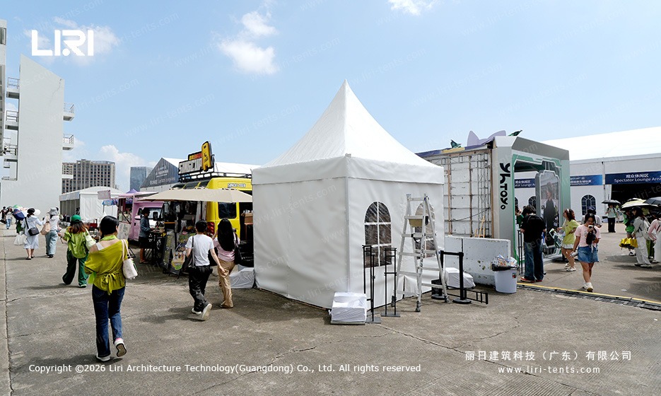 Small pagoda tent at race paddock vendor area for activation booths
