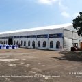 Long clear span marquee as race track spectator lounge with arched windows