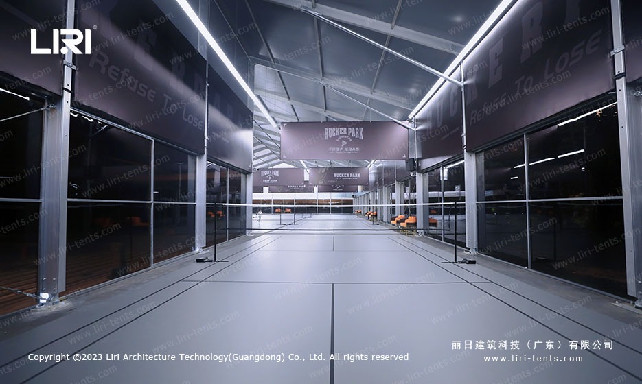 End wall view of sports hall marquee with banners and engineered aluminum frame structure